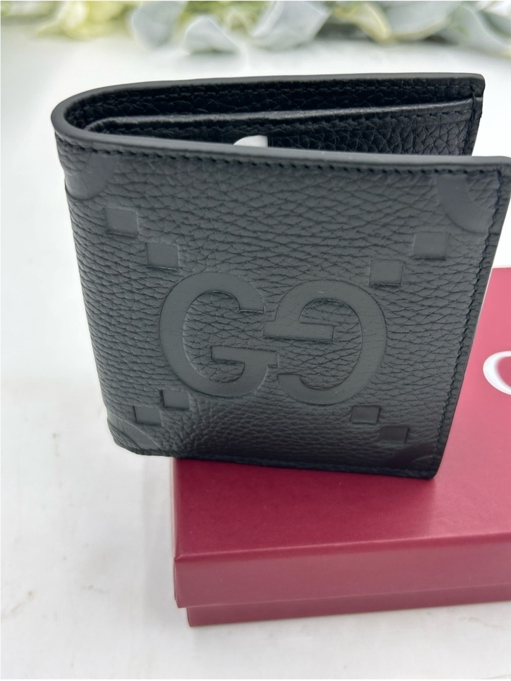 Men’s Gucci, jumbo GG leather bifold wallet made in Italy